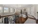 Elegant foyer with a curved staircase, hardwood floors, and a decorative chandelier at 300 Annelise Park Dr, Fayetteville, GA 30214