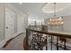 A landing at the top of a winding staircase with views to lower floors at 300 Annelise Park Dr, Fayetteville, GA 30214