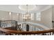 Elegant foyer with chandelier lighting and curved staircase at 300 Annelise Park Dr, Fayetteville, GA 30214