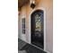 Elegant front door with intricate ironwork and premium hardware, providing a secure and stylish entrance at 300 Annelise Park Dr, Fayetteville, GA 30214