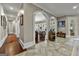 Hallway featuring stone floors and arched doorways that offer seamless transition between rooms at 300 Annelise Park Dr, Fayetteville, GA 30214