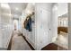 Hallway with decorative wall trim, hardwood floors, recessed lights, decorative accents, and white doors at 300 Annelise Park Dr, Fayetteville, GA 30214