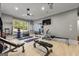 Home gym featuring workout equipment, mirrors, and ample natural light, creating a motivating fitness space at 300 Annelise Park Dr, Fayetteville, GA 30214