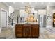 Open concept kitchen with stainless steel appliances, a large central island, and custom cabinets at 300 Annelise Park Dr, Fayetteville, GA 30214