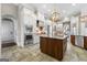 Open concept kitchen with stainless steel appliances, a large central island, and custom cabinets at 300 Annelise Park Dr, Fayetteville, GA 30214