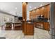 Gourmet kitchen and living room, complete with custom wood cabinets and stainless steel appliances at 300 Annelise Park Dr, Fayetteville, GA 30214