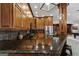 Stylish kitchen with wood cabinets, granite countertops, and stainless steel appliances at 300 Annelise Park Dr, Fayetteville, GA 30214