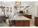 Kitchen island with marble countertop overlooks the breakfast nook and Gathering room at 300 Annelise Park Dr, Fayetteville, GA 30214