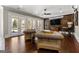 The spacious living room features hardwood floors, a custom wood feature wall, and plenty of natural light at 300 Annelise Park Dr, Fayetteville, GA 30214