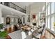 Cozy living room with a fireplace, balcony, and large windows providing ample natural light at 300 Annelise Park Dr, Fayetteville, GA 30214