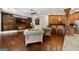 Inviting living room featuring hardwood floors, a wood-paneled wall, and a bar area at 300 Annelise Park Dr, Fayetteville, GA 30214