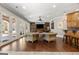 The spacious living room features hardwood floors, a custom wood feature wall, and plenty of natural light at 300 Annelise Park Dr, Fayetteville, GA 30214