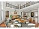 Spacious living room with a decorative bull skull and seamless access to dining area at 300 Annelise Park Dr, Fayetteville, GA 30214