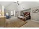 Spacious main bedroom with vaulted ceiling, plush carpet, a decorative bed and a window seat at 300 Annelise Park Dr, Fayetteville, GA 30214