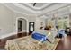 Spacious main bedroom features hardwood floors, neutral paint, recessed lighting, and large windows with custom window treatments at 300 Annelise Park Dr, Fayetteville, GA 30214