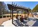 Inviting outdoor seating area with a pergola and lush landscaping at 300 Annelise Park Dr, Fayetteville, GA 30214