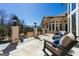 Inviting outdoor patio with comfortable seating and a serene view of the lush backyard and pool at 300 Annelise Park Dr, Fayetteville, GA 30214