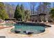 Resort-style pool area with in-pool loungers, a pergola-covered seating area, and lush greenery at 300 Annelise Park Dr, Fayetteville, GA 30214