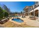 Resort-style backyard with a stunning pool, spa, and outdoor lounge area, perfect for relaxation and entertainment at 300 Annelise Park Dr, Fayetteville, GA 30214