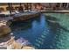Crystal clear pool with built in rock waterfall for a relaxing and enjoyable swimming experience at 300 Annelise Park Dr, Fayetteville, GA 30214
