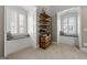 This sitting room features window seats and custom built-in shelving at 300 Annelise Park Dr, Fayetteville, GA 30214
