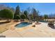 Relax in this backyard spa, surrounded by manicured landscaping and stone accents at 300 Annelise Park Dr, Fayetteville, GA 30214