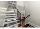 Staircase with stair lights and patterned carpet runner at 300 Annelise Park Dr, Fayetteville, GA 30214