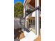 Exterior wrought iron spiral staircase with stone columns and archway at 300 Annelise Park Dr, Fayetteville, GA 30214
