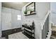 Well-decorated foyer with a staircase and stylish console table at 70 High Point Way, Hiram, GA 30141