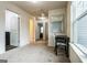 Upstairs hallway with neutral carpet and a window seat desk at 70 High Point Way, Hiram, GA 30141