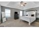 Comfortable primary bedroom showcasing a ceiling fan, dresser, and a serene atmosphere at 70 High Point Way, Hiram, GA 30141