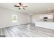 Open concept living area with gray flooring and plenty of natural light at 293 Limestone Circle, Conyers, GA 30013