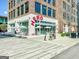 Inviting exterior view of Hero Doughnuts & Buns, featuring outdoor seating and charming architectural details at 135 Edgewater Trl, Fayetteville, GA 30215