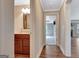 Hallway view with half-bath and doorway views into the bedroom and living room areas at 135 Edgewater Trl, Fayetteville, GA 30215