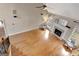 Spacious living room with fireplace, hardwood floors and lots of light from large windows at 135 Edgewater Trl, Fayetteville, GA 30215