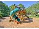 Community playground featuring a slide, climbing area and open space at 135 Edgewater Trl, Fayetteville, GA 30215