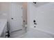 Bright bathroom boasts a white tub/shower combo and modern fixtures at 3264 Greenhill Ct, Villa Rica, GA 30180