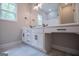 Bathroom featuring double sink vanity with white cabinets and stylish black hardware at 3264 Greenhill Ct, Villa Rica, GA 30180