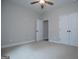 Carpeted bedroom featuring a double door closet and ceiling fan at 3264 Greenhill Ct, Villa Rica, GA 30180