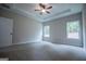 Spacious bedroom with natural light and a tray ceiling at 3264 Greenhill Ct, Villa Rica, GA 30180