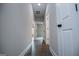 Hallway with dark floors and white doors at 3264 Greenhill Ct, Villa Rica, GA 30180