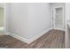 Hallway view with wooden floor leading to a laundry area at 3264 Greenhill Ct, Villa Rica, GA 30180