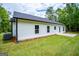 A modern white home exterior showing a well-kept lawn and a newly installed AC unit at 3264 Greenhill Ct, Villa Rica, GA 30180