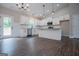 Bright kitchen featuring white cabinets, granite countertops, stainless appliances, and hardwood floors at 3264 Greenhill Ct, Villa Rica, GA 30180