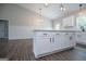 Open kitchen featuring a granite countertop island and stainless steel sink at 3264 Greenhill Ct, Villa Rica, GA 30180