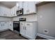 Beautiful kitchen features white cabinets, stainless steel oven, and granite countertops at 3264 Greenhill Ct, Villa Rica, GA 30180