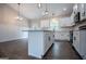 Beautiful kitchen featuring a granite countertop island, stainless steel sink, and recessed lighting at 3264 Greenhill Ct, Villa Rica, GA 30180