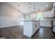 A kitchen with an island and stainless steel appliances in an open-concept space at 3264 Greenhill Ct, Villa Rica, GA 30180