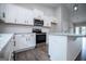 Modern kitchen with white cabinets, stainless steel appliances, and granite countertops at 3264 Greenhill Ct, Villa Rica, GA 30180