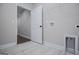 Bright laundry room featuring modern tile flooring and white shelving at 3264 Greenhill Ct, Villa Rica, GA 30180